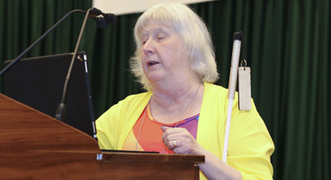 The President of the NFB of Texas, Norma Crosby, addresses the convention.